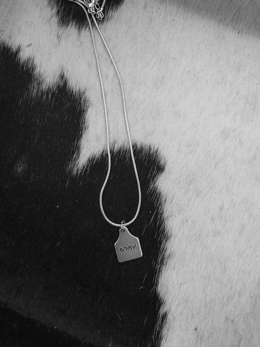God is Greater cattle tag necklace